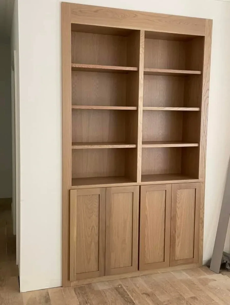 Natural oak fitted shelving with lower cabinet doors