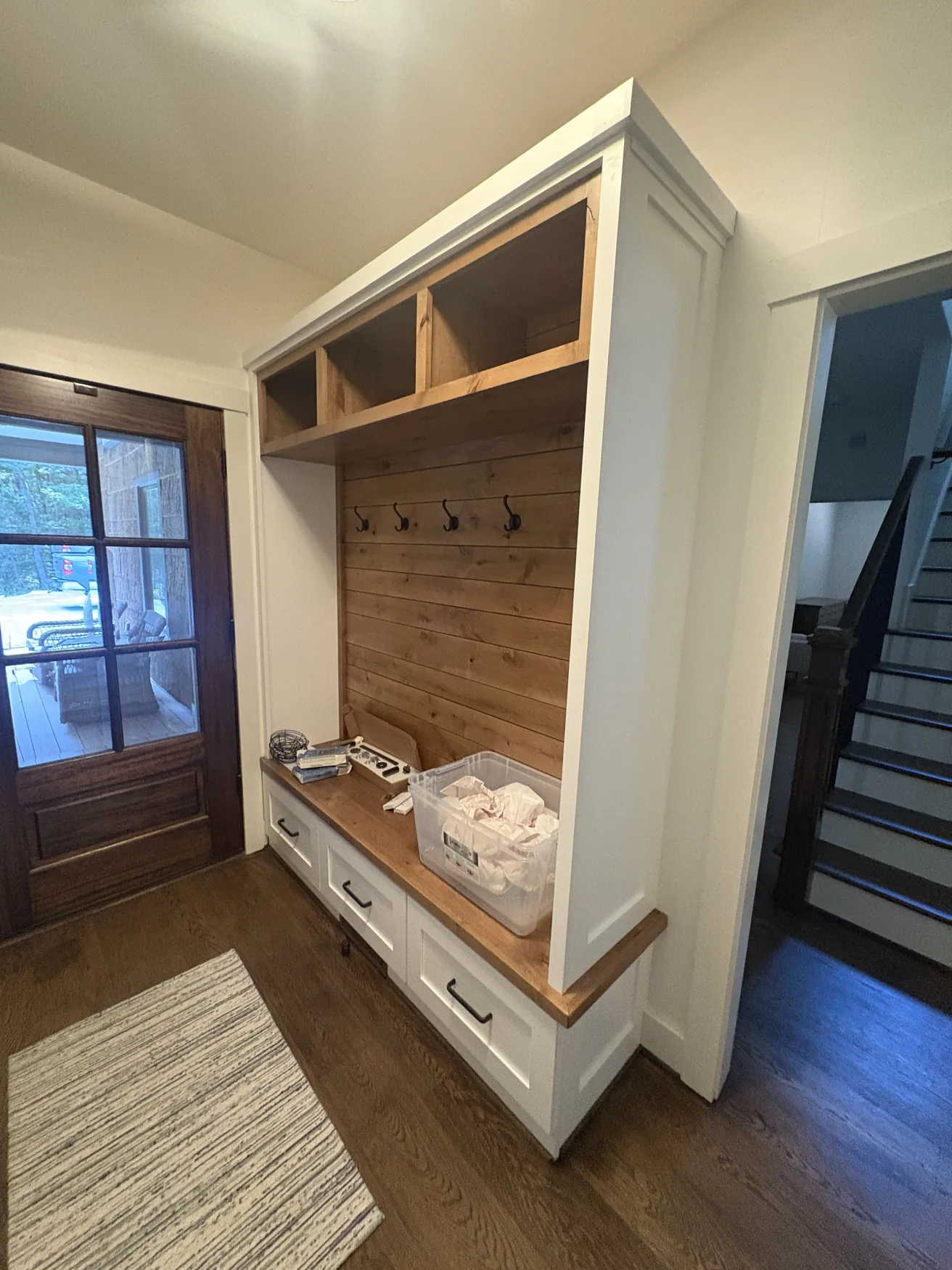 Warm wooden seating alcove with custom cabinetry