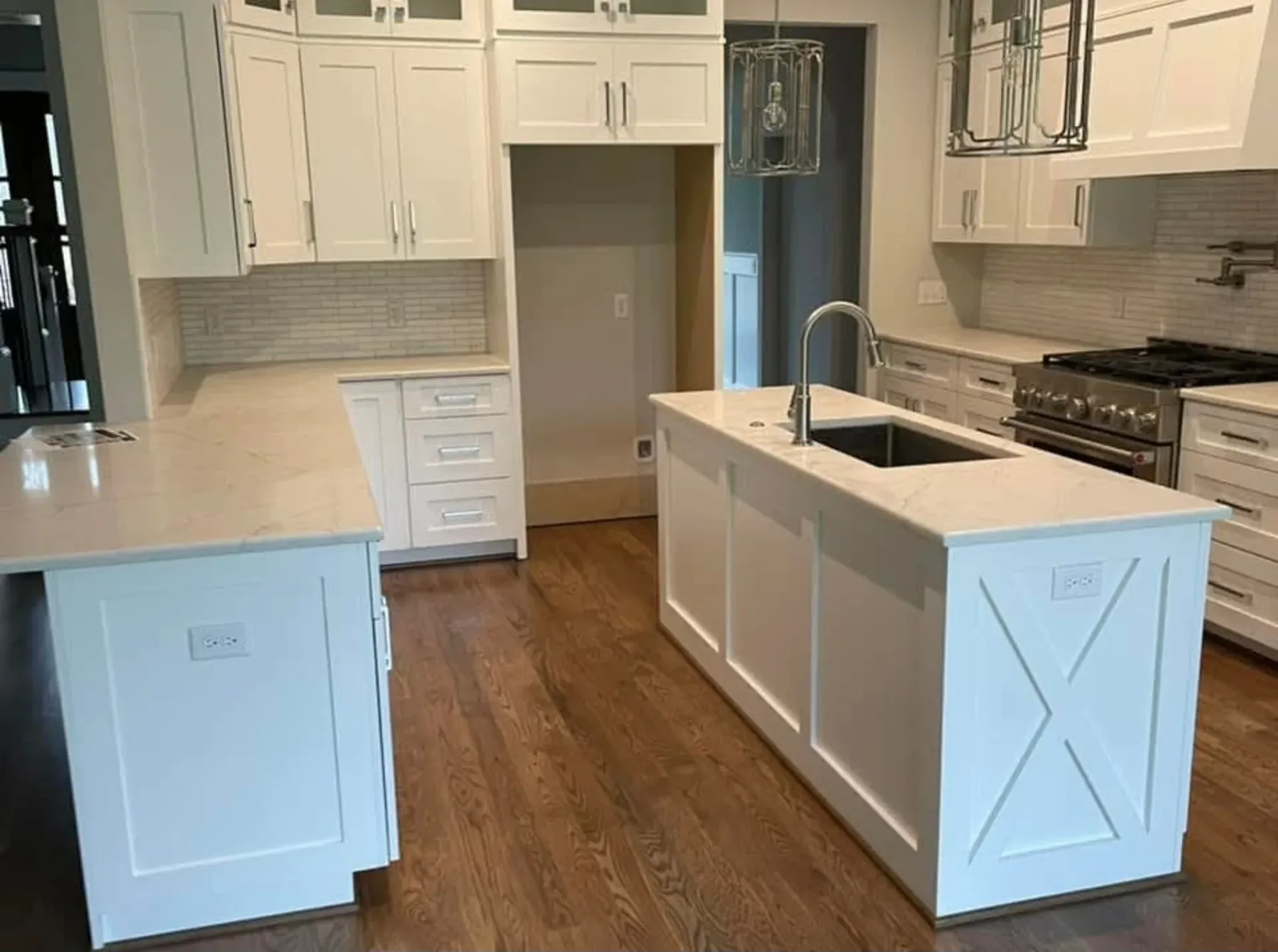 White kitchen with fitted storage and a generous island